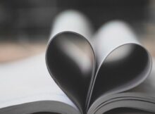 closeup photography of book page folding forming heart